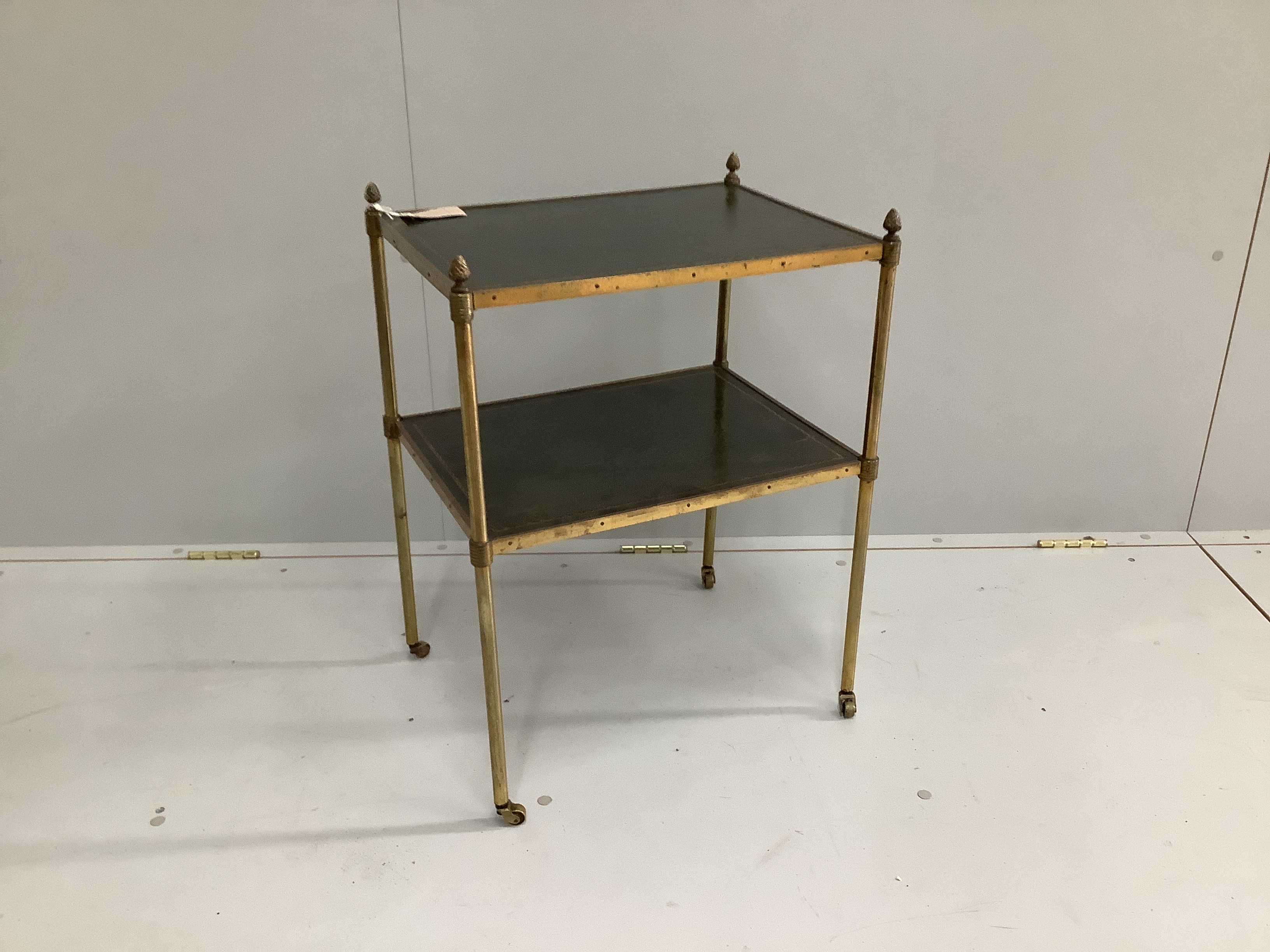 A Maison Jansen style leather inset brass two tier occasional table, width 48cm, depth 37cm, height 64cm